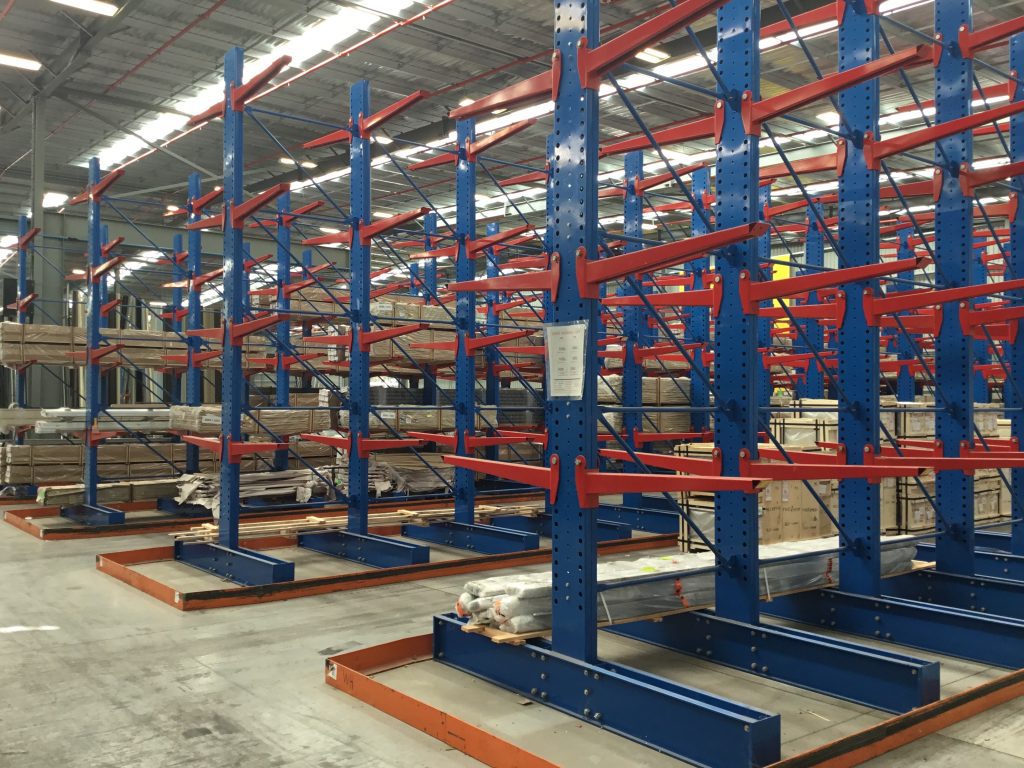 Unloaded cantilever racking in a warehouse.